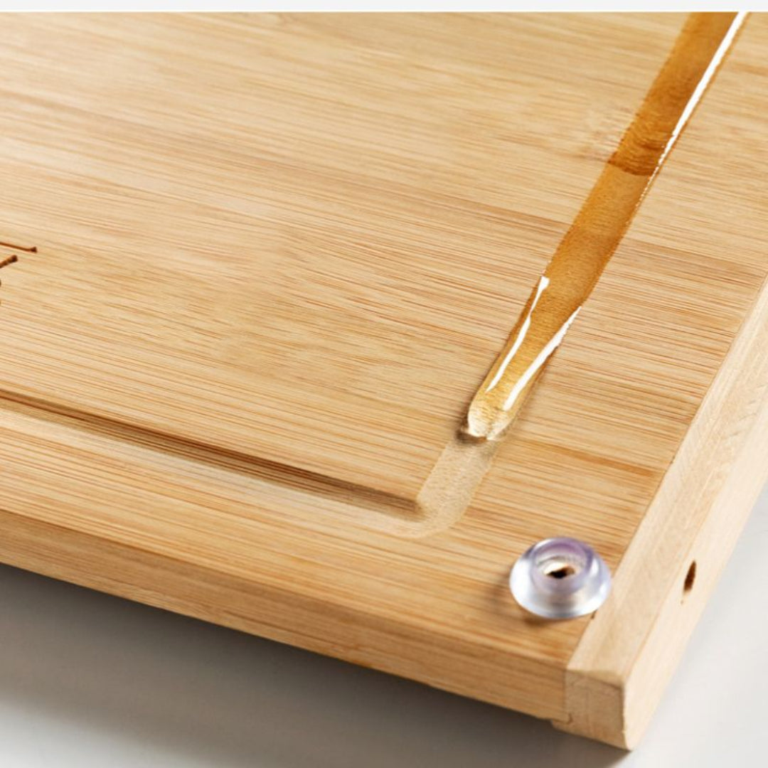 Close-up of a wooden surface with a drop of water on it
