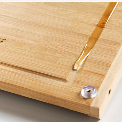 Close-up of a wooden surface with a drop of water on it