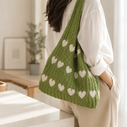 Josh & Tate - KnitLove™ Heart Pattern Tote - Person holding a green knitted bag with heart patterns in a home setting.