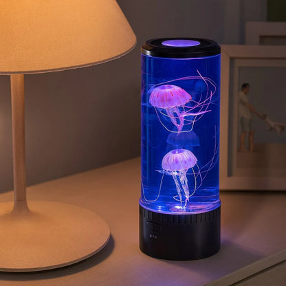 Josh & Tate - LED Jellyfish Ambient Night Lamp - Jellyfish lamp on a table with a blurred background