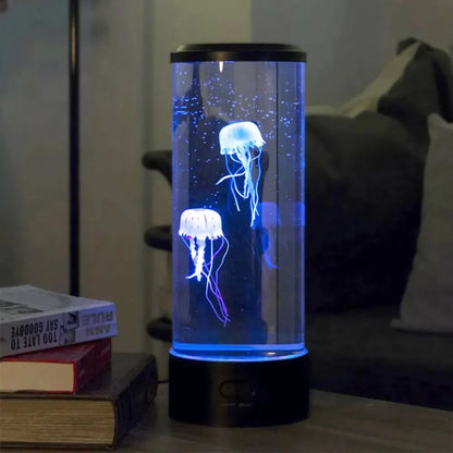 Josh & Tate - LED Jellyfish Ambient Night Lamp - Glass container with glowing jellyfish on a table