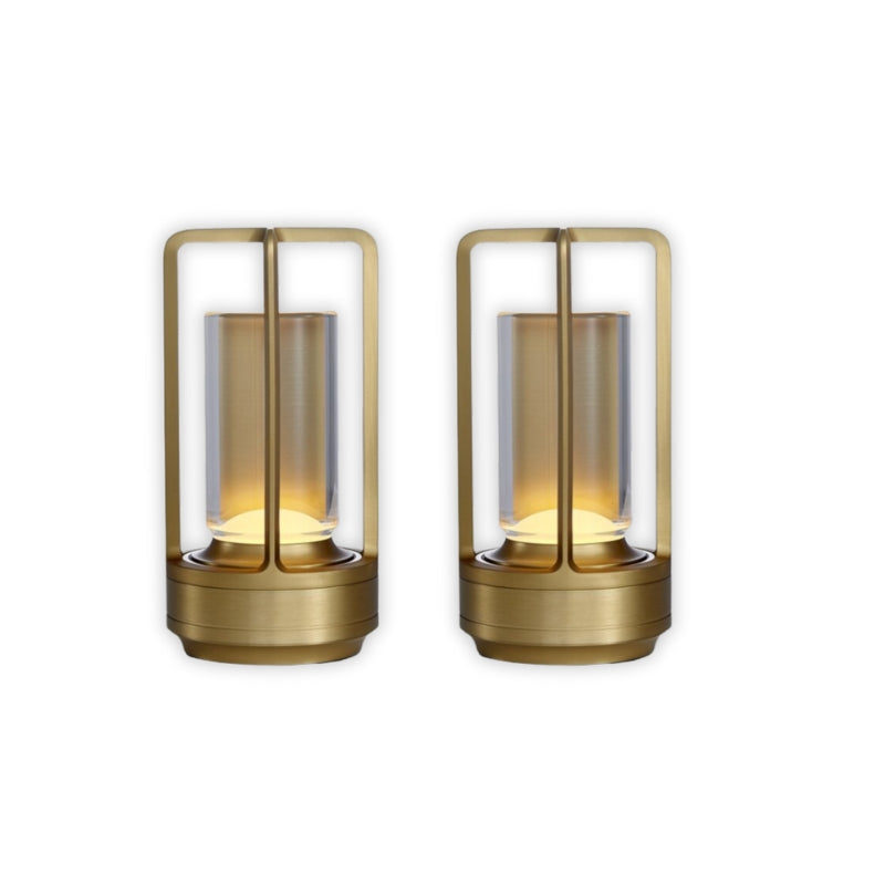 Two gold outdoor lanterns on a white background