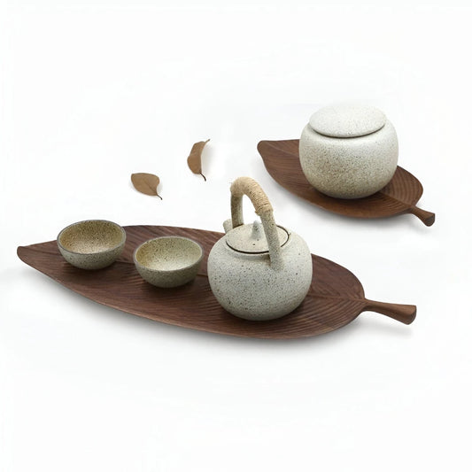 Josh & Tate - Leaf Shaped Wooden Serving Tray - Ceramic tea set with teapot, cups, and leaf-shaped trays on a white background