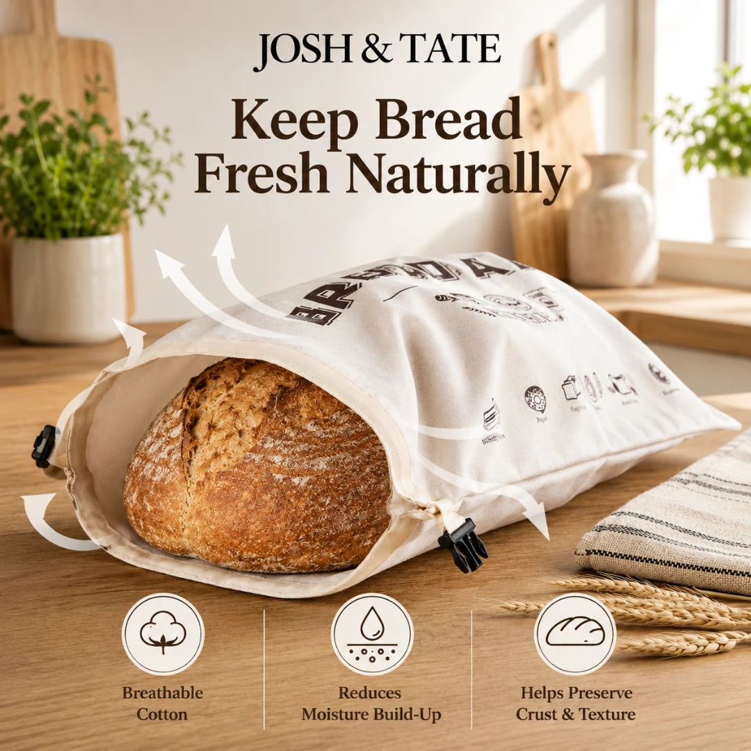 Josh & Tate - LoafSack™ Cotton Bread Bag - Bread in a breathable cotton bag with 'Josh & Tate' branding on a wooden surface.