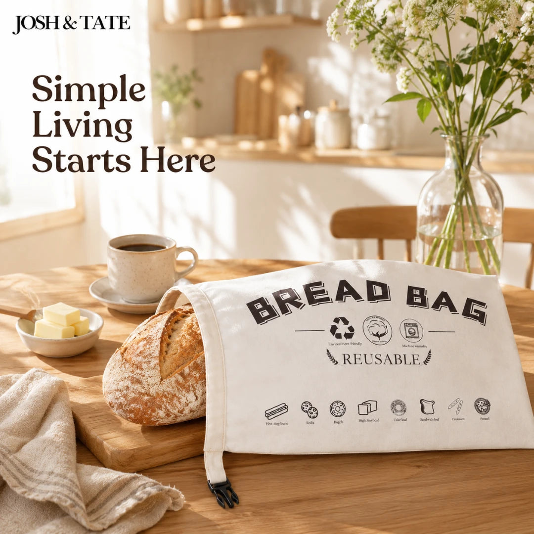 Josh & Tate - LoafSack™ Cotton Bread Bag - Bread bag on a table with bread, coffee, and flowers in a kitchen setting.