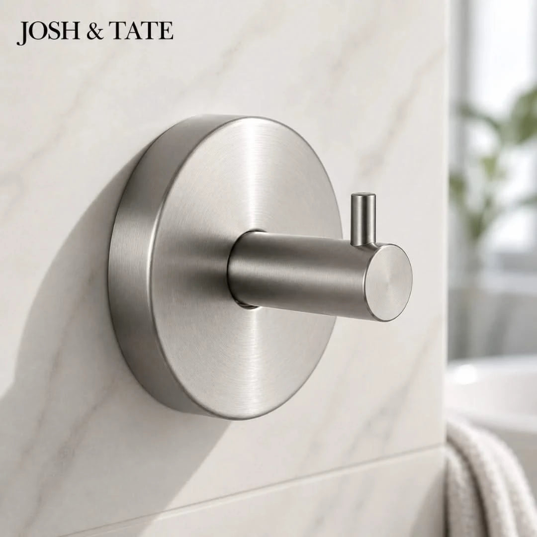 Josh & Tate -LockDisc™ Twist-Lock Wall Hook Set - Metallic wall hook on a tiled wall with 'JOSH & TATE' branding.
