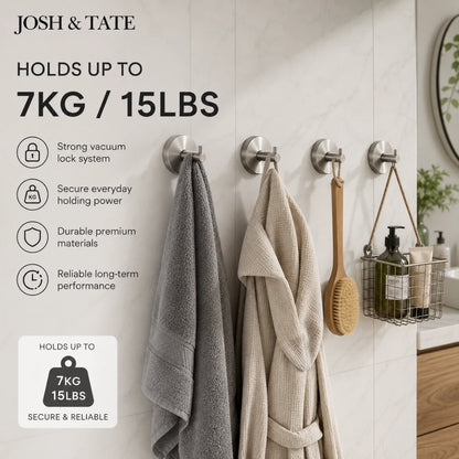 Josh & Tate - LockDisc™ Twist-Lock Wall Hook Set - Wall hooks holding towels and a robe in a bathroom setting with product features listed.