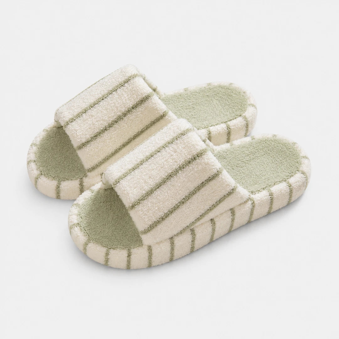 Josh & Tate - LoftWear™ Striped Slide Slippers - A pair of plush slide slippers with cream-colored textured straps and light sage green stripes, featuring a matching sage green footbed, shown on a clean white background.