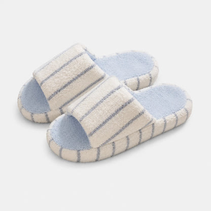 Josh & Tate - LoftWear™ Striped Slide Slippers - A pair of plush slide slippers with cream-colored straps featuring blue stripes, light blue footbeds, and matching blue trim, shown on a light gray background.