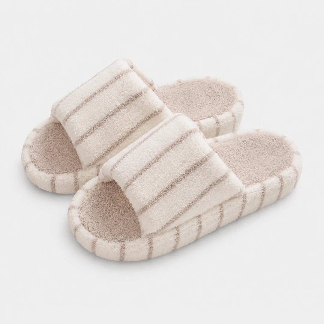 Josh & Tate - LoftWear™ Striped Slide Slippers - A pair of light beige slide sandals with textured, ribbed straps and a contoured footbed, shown on a clean white background.