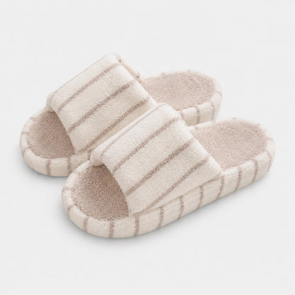 Josh & Tate - LoftWear™ Striped Slide Slippers - A pair of light beige slide sandals with textured, ribbed straps and a contoured footbed, shown on a clean white background.