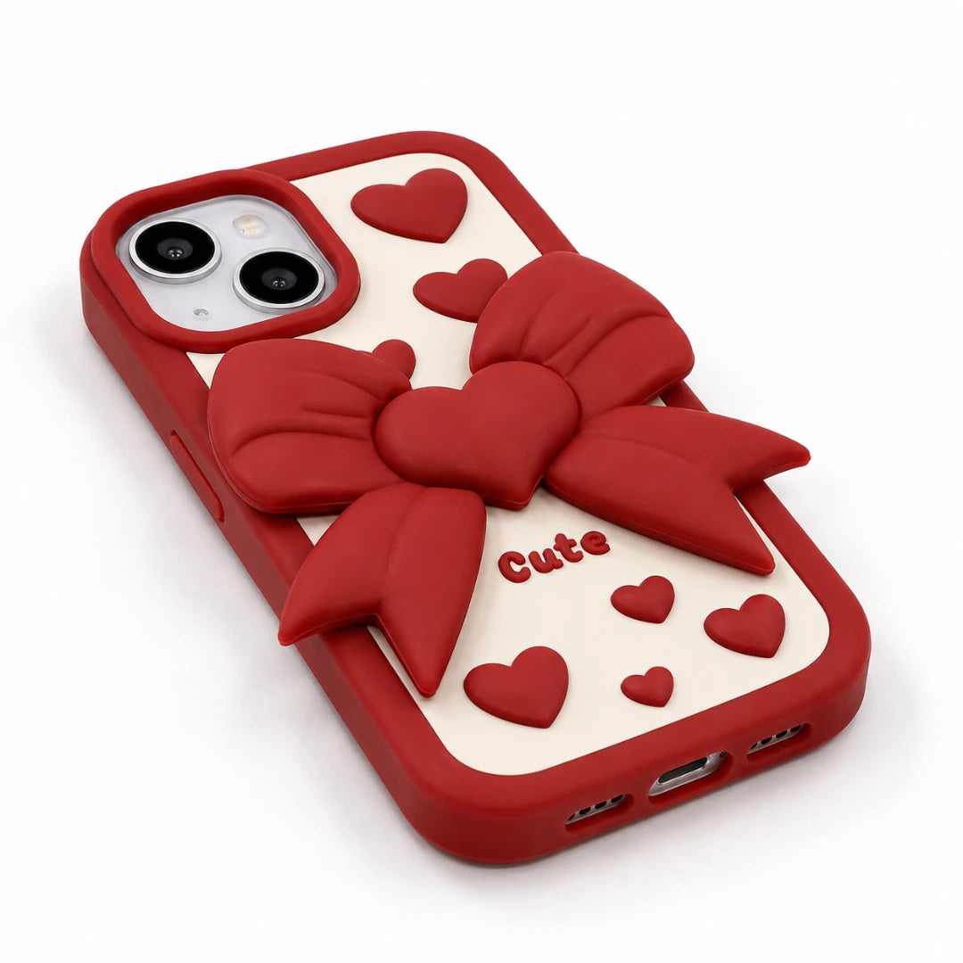 Josh & Tate - LoveBow™ Anti-Drop Phone Case - Red phone case with a 3D red bow and heart design on a cream-colored back panel, featuring the word 'Cute' in red text, shown on a white background.