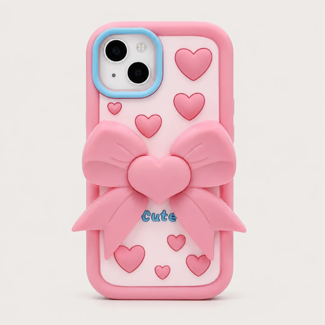 Josh & Tate - LoveBow™ Anti-Drop Phone Case - A pink phone case with a 3D pink bow design, small pink hearts, and the word 'Cute' in blue text, shown on a light gray background.