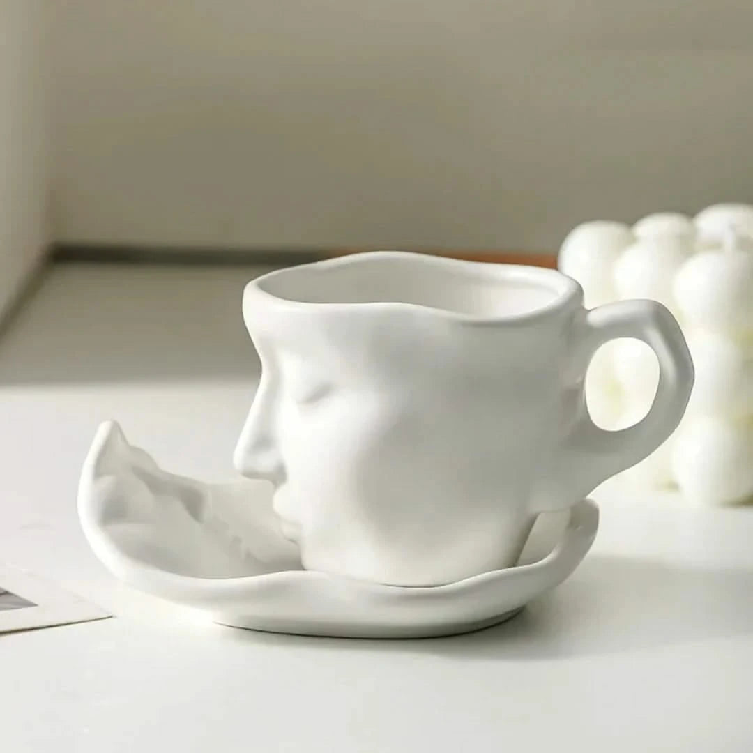 Josh & Tate - Lover's Gaze Reverie Coffee Ceramic Mug - White ceramic face-shaped mug and saucer on a light surface