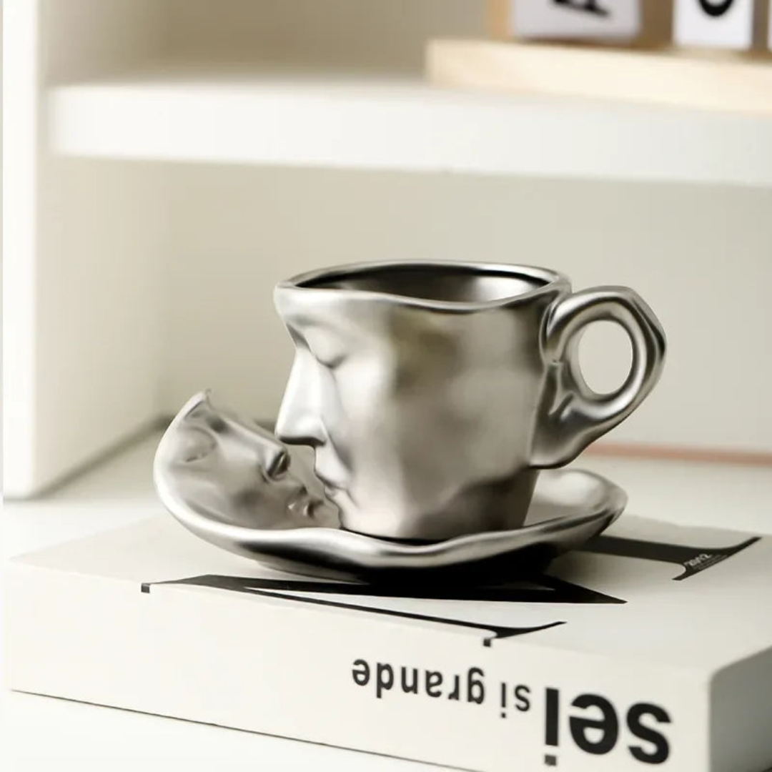 Silver coffee cup and saucer on a box with 'sei grande' text