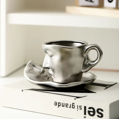 Silver coffee cup and saucer on a box with 'sei grande' text