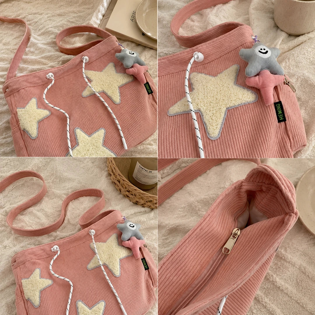 Josh & Tate - LuckyStar™ Ribbed Tote Bag  - A pink corduroy shoulder bag shown in a four-panel collage on a soft beige fabric surface. The bag has large cream star appliqués, white rope drawstrings, a small gray plush star charm, and a zippered compartment.
