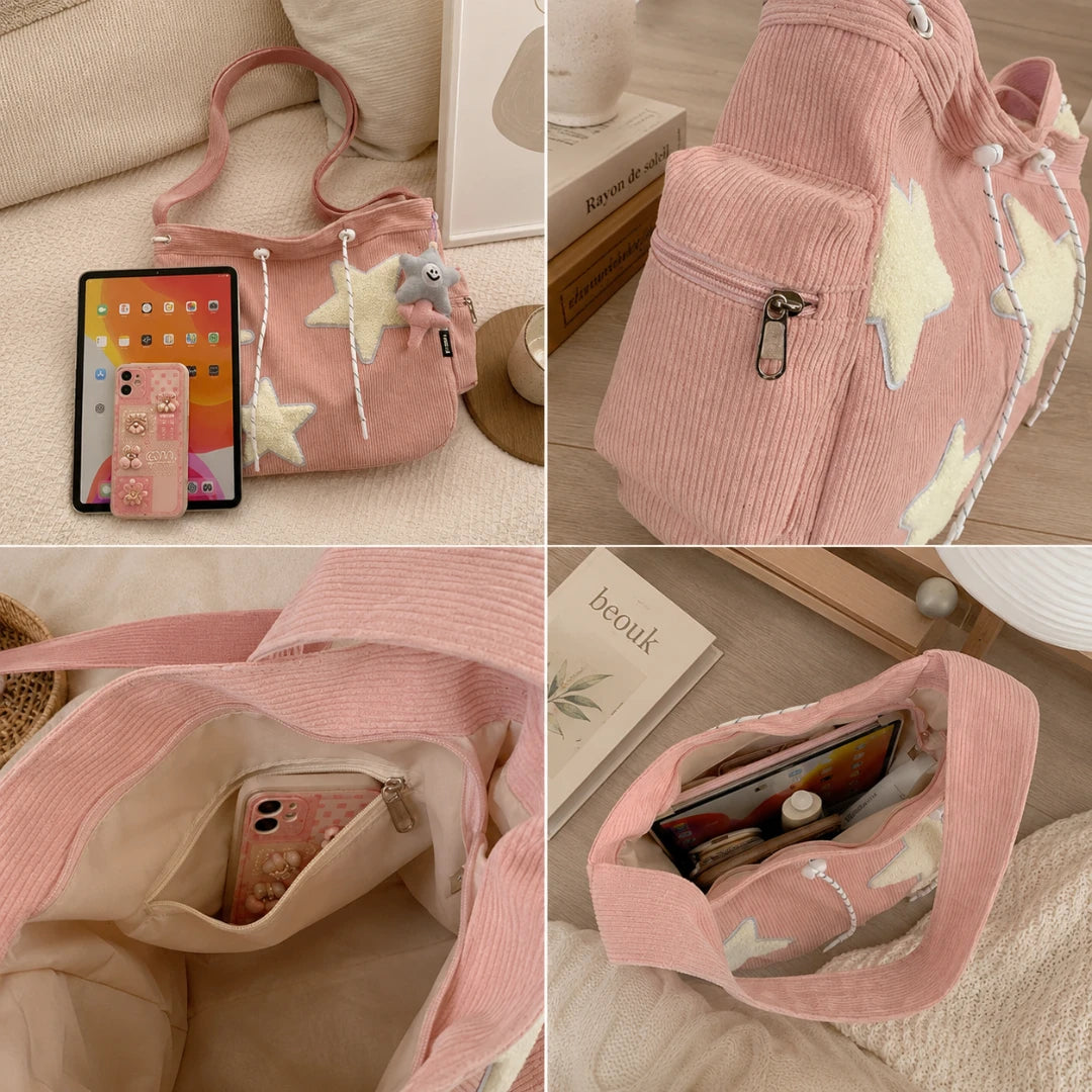 Josh & Tate - LuckyStar™ Ribbed Tote Bag  - A pink corduroy shoulder bag shown in a four-panel collage on a soft beige surface. The bag has cream star appliques, a small plush charm, a zipper pocket, and multiple open pockets.