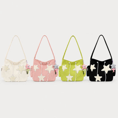 Josh & Tate - LuckyStar™ Ribbed Tote Bag  - Four fabric shoulder bags in cream, pink, lime green, and black, each decorated with white star appliqués and small plush charms, displayed against a light gray background.