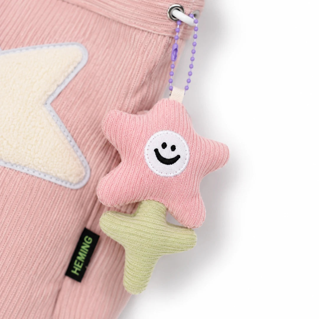Josh & Tate - LuckyStar™ Ribbed Tote Bag  - A pink corduroy baby accessory with a cream star applique and a hanging plush star keychain in pink and pale yellow-green, attached to a purple bead chain.