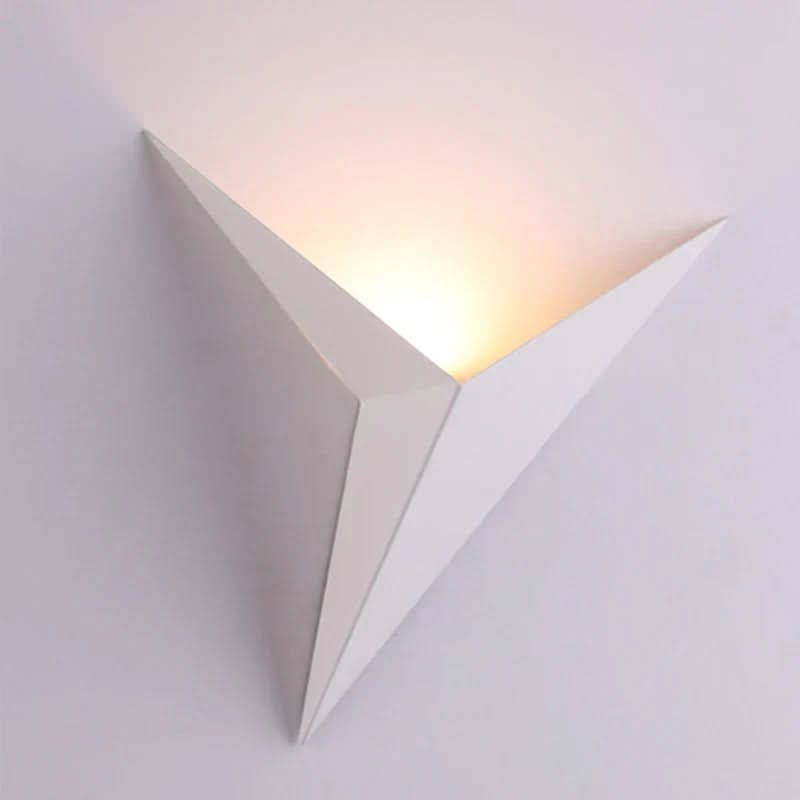 Triangular wall light fixture on a white background