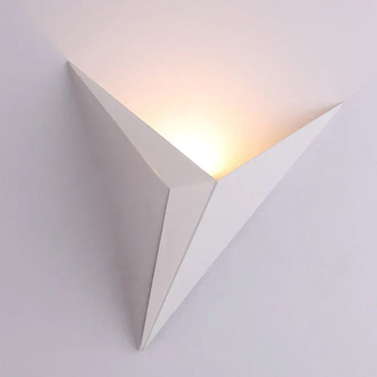 Triangular wall light fixture on a white background