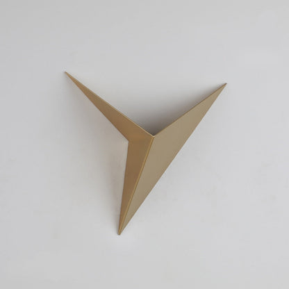 Gold metallic triangle wall art on a white background