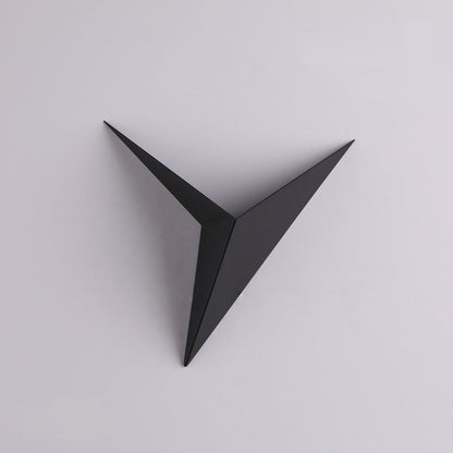 Black geometric wall art on a light gray background