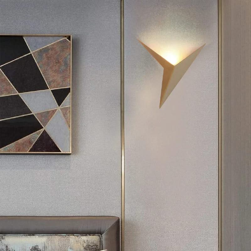 Modern wall lamp and abstract art on a textured wall