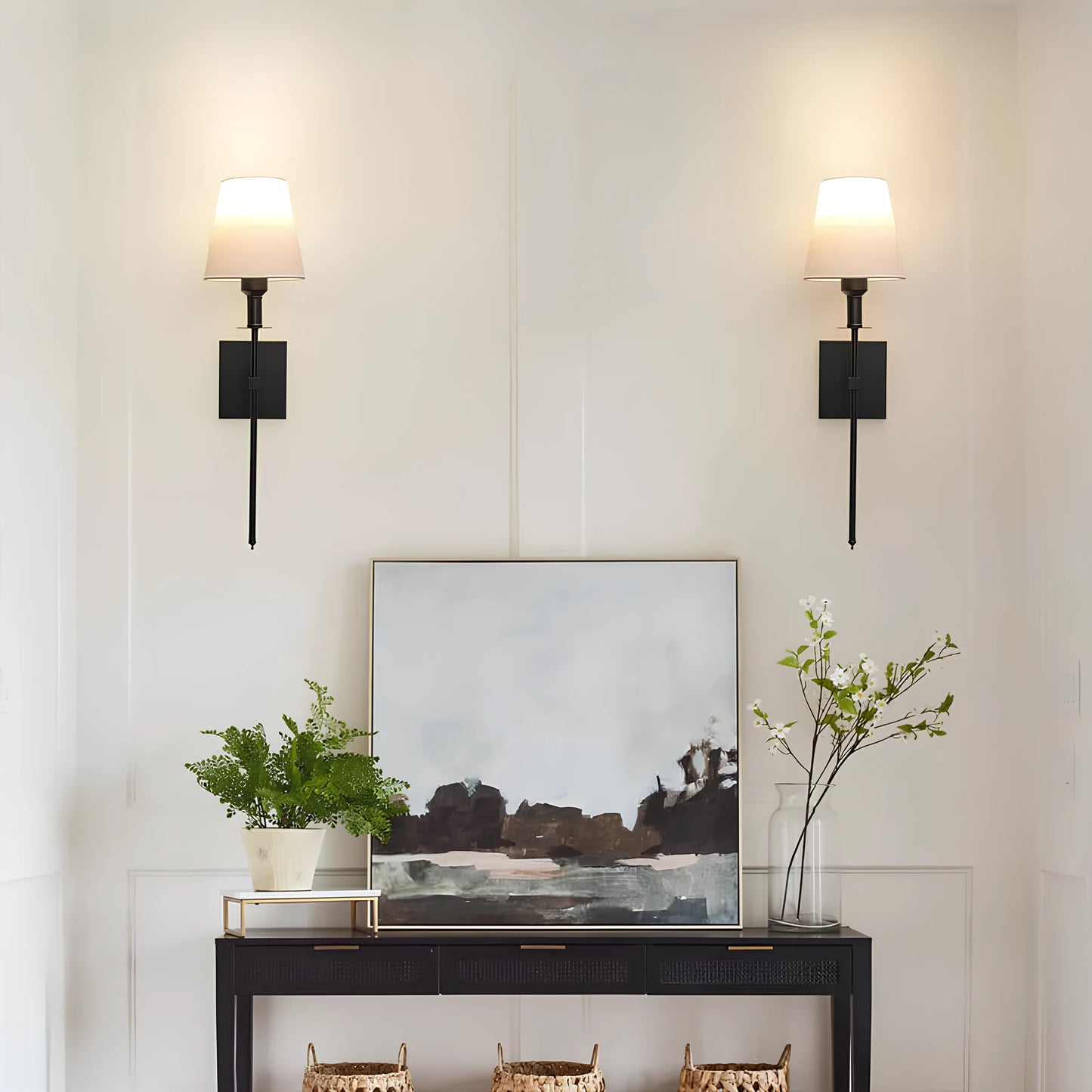 Josh & Tate - LumaElegance Wireless Wall Lamp - Modern interior with a console table, abstract painting, and wall sconces.