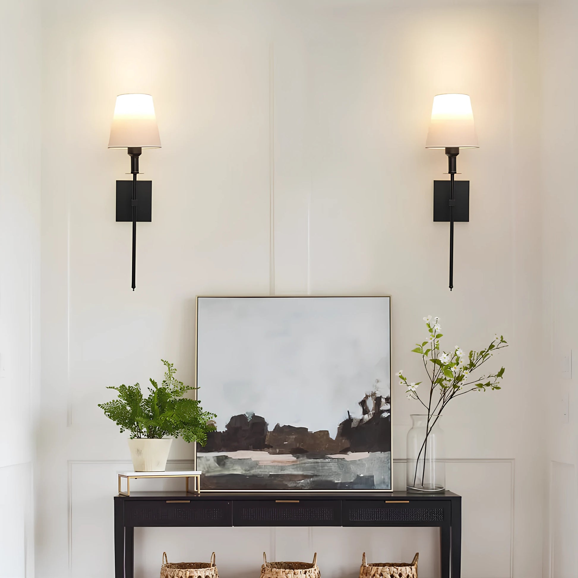 Josh & Tate - LumaElegance Wireless Wall Lamp - Modern interior with a console table, abstract painting, and wall sconces.