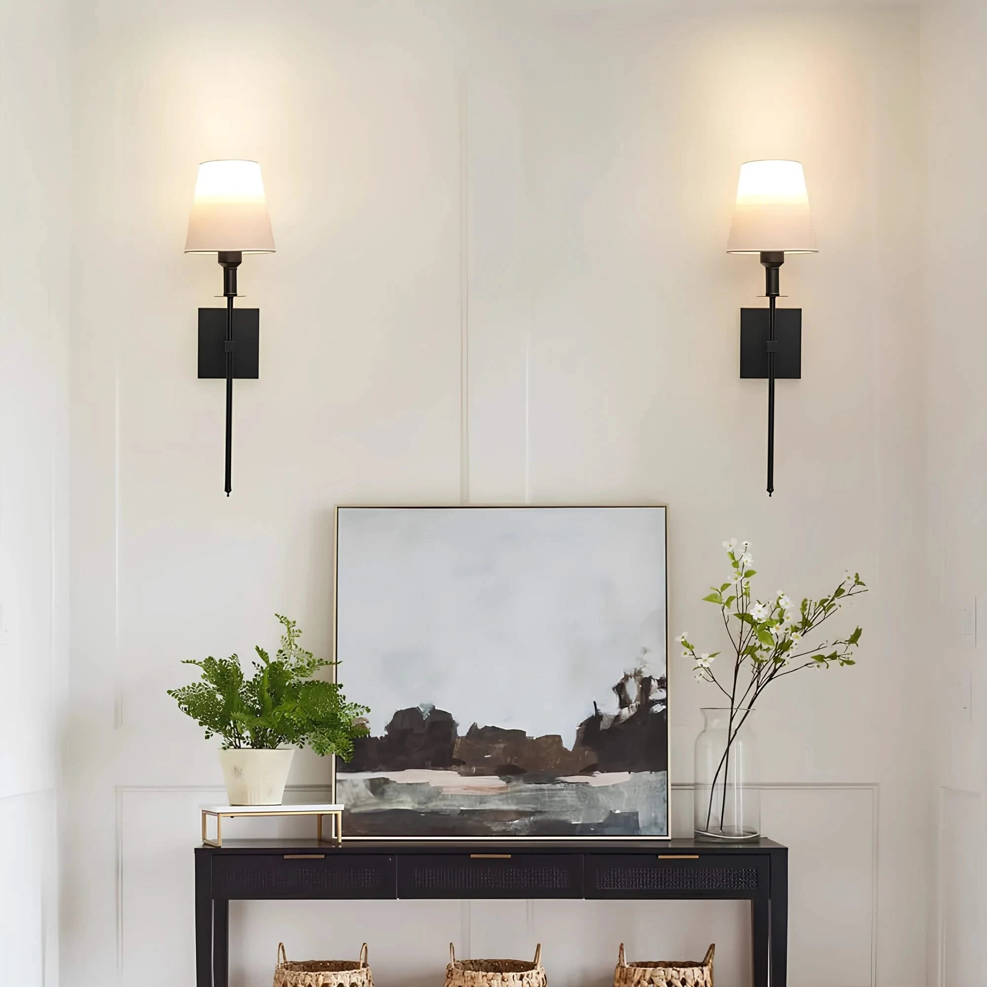 Josh & Tate - LumaElegance Wireless Wall Lamp - Modern interior with a console table, abstract painting, and wall sconces.