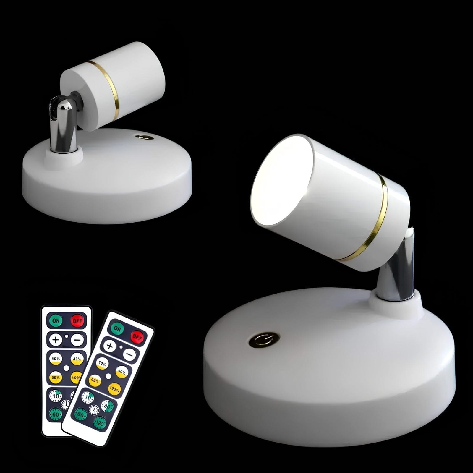 Two adjustable LED spotlights with remote controls on a black background