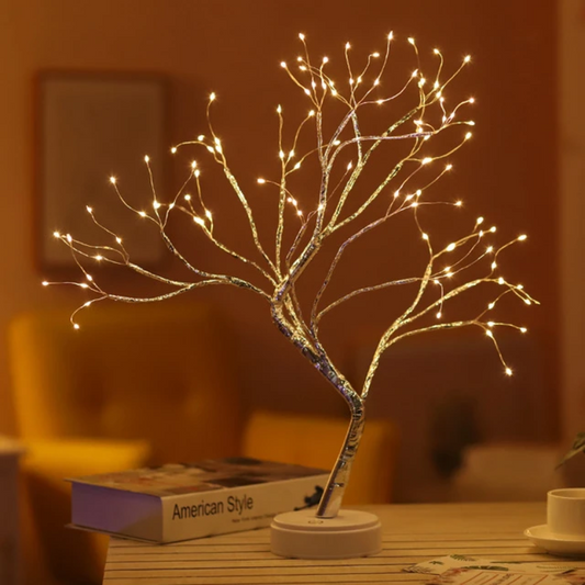Decorative LED tree on a table with a warm ambiance