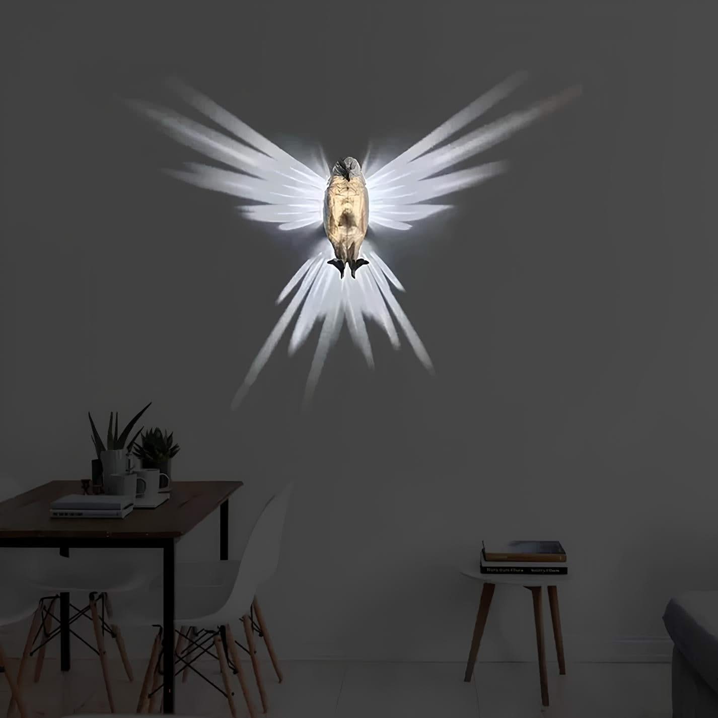 Decorative wall light shaped like a bird with spread wings on a dark wall.