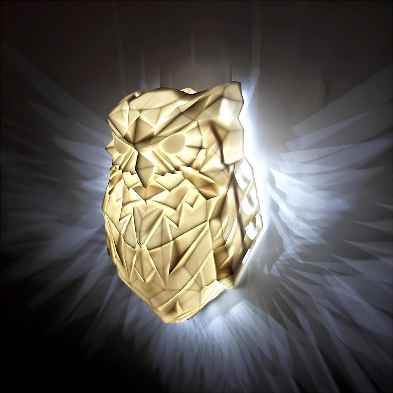 Gold owl-shaped object with a dark background