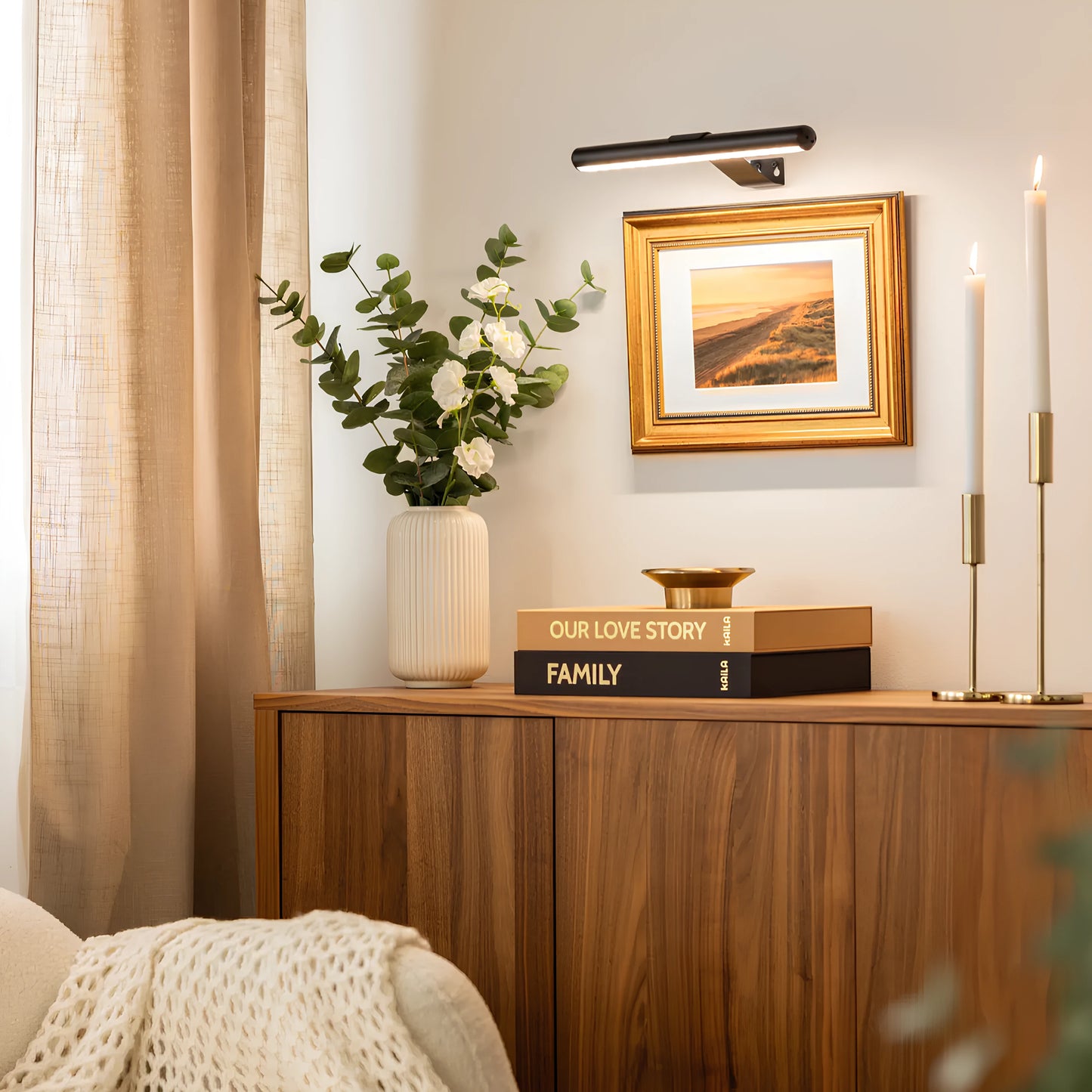 Josh & Tate -  LumeArt Wireless Art Lamp - Nursery room with wooden dresser, framed picture, and decorative items.