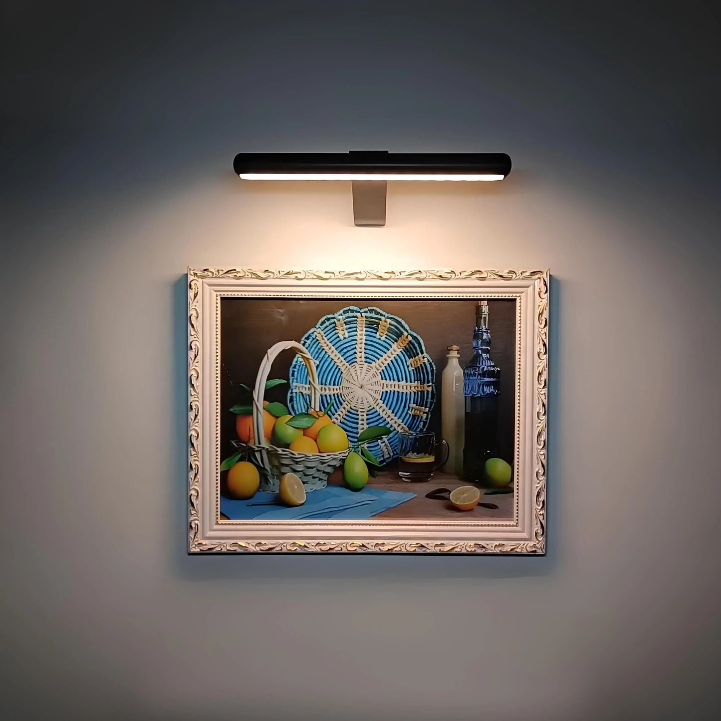 Josh & Tate -  LumeArt Wireless Art Lamp - Decorative still life painting illuminated by a wall-mounted light fixture.