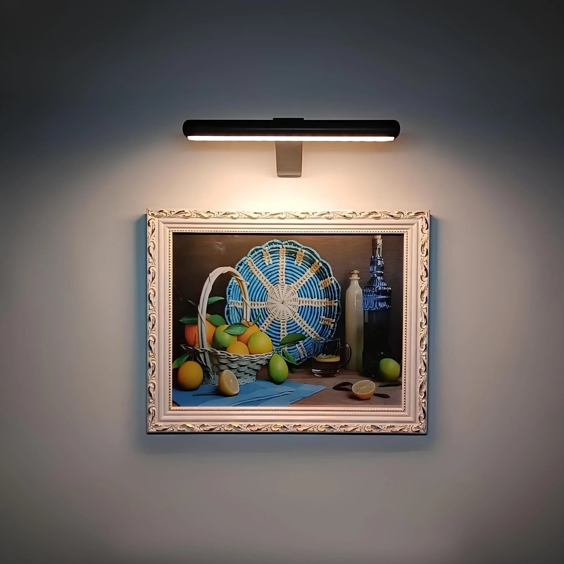Josh & Tate -  LumeArt Wireless Art Lamp - Decorative still life painting illuminated by a wall-mounted light fixture.