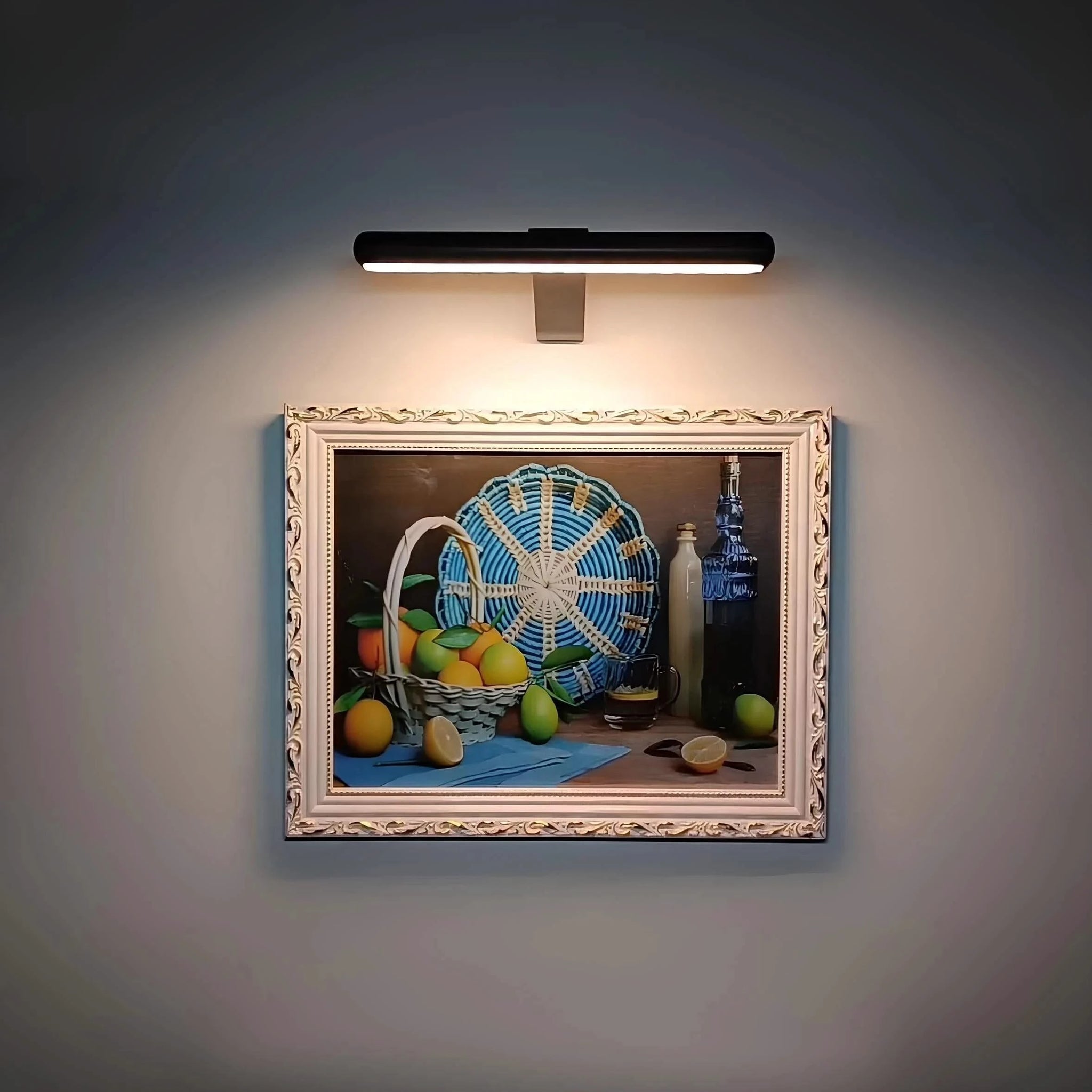 Josh & Tate -  LumeArt Wireless Art Lamp - Decorative still life painting illuminated by a wall-mounted light fixture.