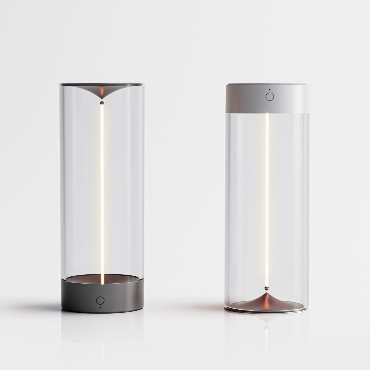 Two cylindrical lamps with glass covers on a white background