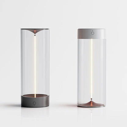 Two cylindrical lamps with glass covers on a white background