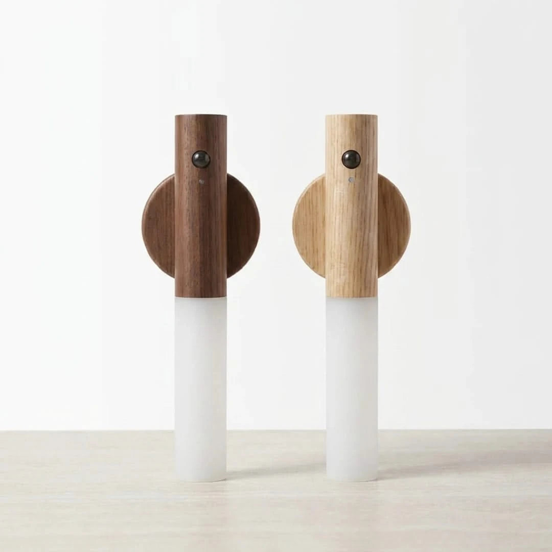 Josh & Tate - LumiDock™ Motion Wall Light - Two wall-mounted lamps with wooden and white design on a light background