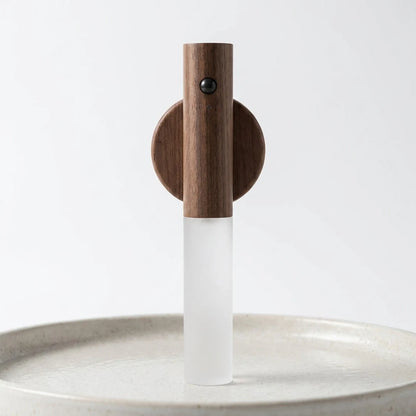 Josh & Tate - LumiDock™ Motion Wall Light - Wooden faucet with white spout on a light gray background