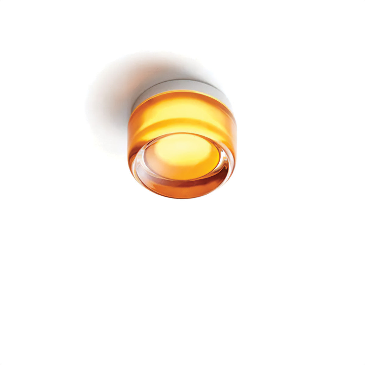 Round orange light fixture on a white background