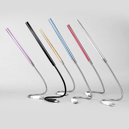Set of colorful metal straws on a light gray background