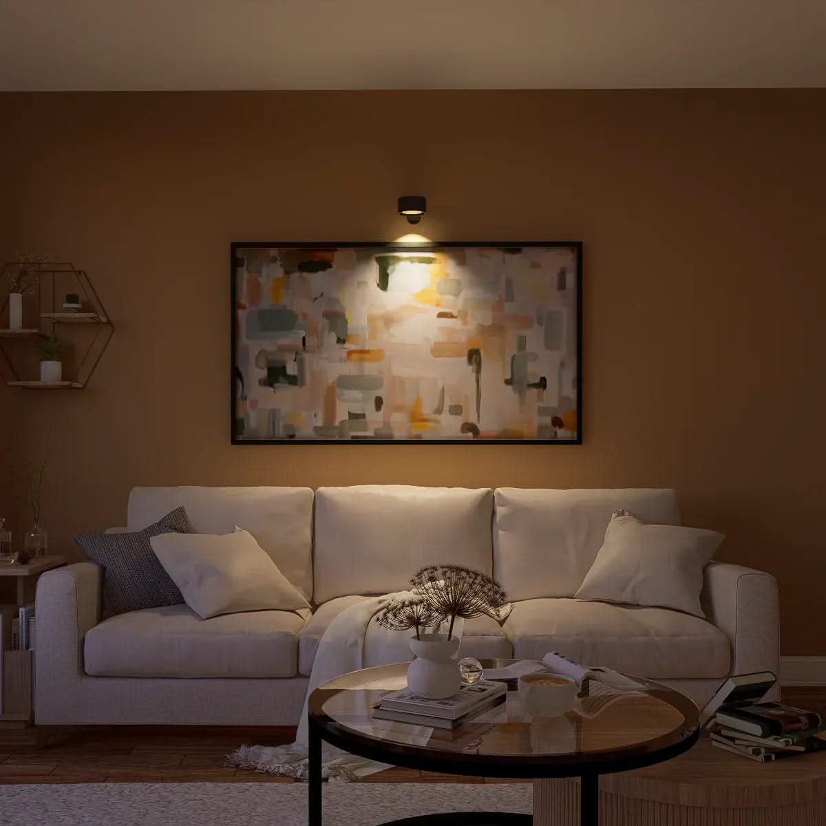 Cozy living room with a white sofa, coffee table, and wall art.