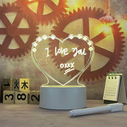 Heart-shaped night light with 'I love you' text in front of mechanical gear background