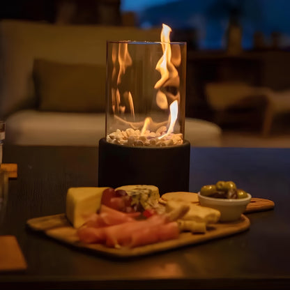 Fire pit with flames on a table in a cozy indoor setting