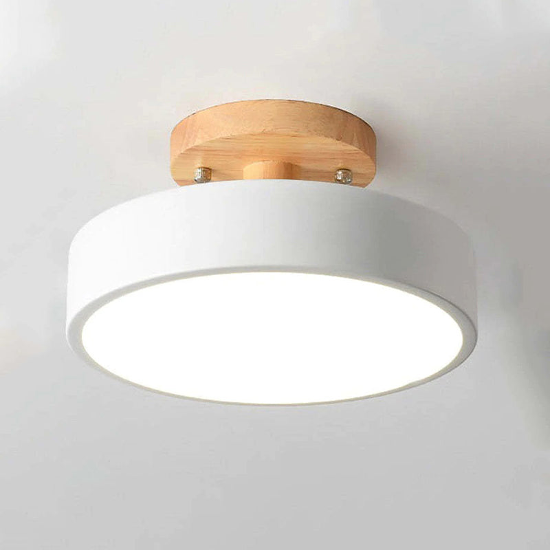 Ceiling light fixture with wooden finish on a plain background